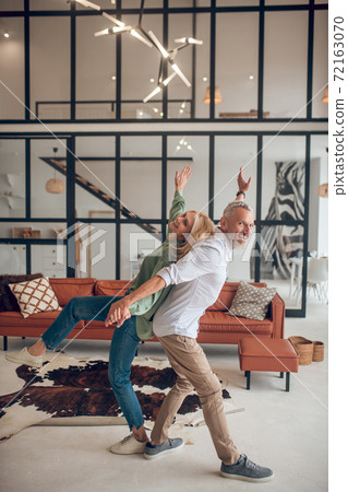 Man and woman spending weekend at home and feeling energized 72163070