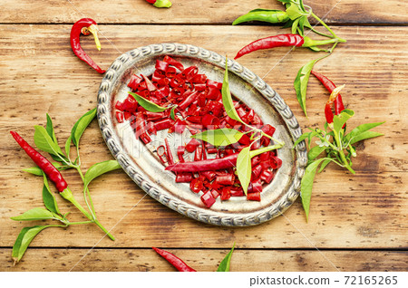 Sliced red chili or cayenne pepper Sliced red chili or cayenne pepper 72165265
