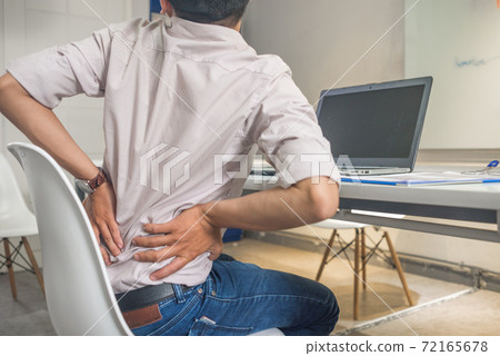 Tired exhausted man feeling pain in back Tired exhausted man feeling pain in back 72165678
