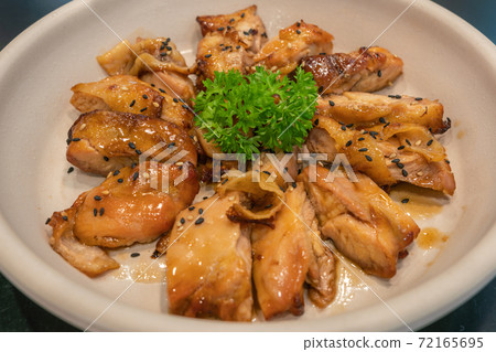 Well decorated Korean fried chicken with soy sauce and sesame 72165695