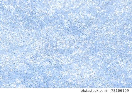 Top view of snow crystals illuminated by sunlight. Winter background. Top view of snow crystals illuminated by sunlight. Winter background. 72166199