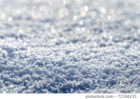 Snow crystals illuminated by sunlight. Winter background. Snow crystals illuminated by sunlight. Winter background. 72166235