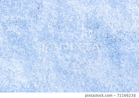 Top view of snow crystals illuminated by sunlight. Winter background. Top view of snow crystals illuminated by sunlight. Winter background. 72166238