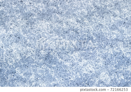 Top view of snow crystals illuminated by sunlight. Winter background. Top view of snow crystals illuminated by sunlight. Winter background. 72166253