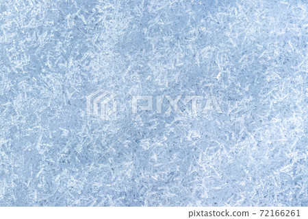 Top view of snow crystals illuminated by sunlight. Winter background. Top view of snow crystals illuminated by sunlight. Winter background. 72166261