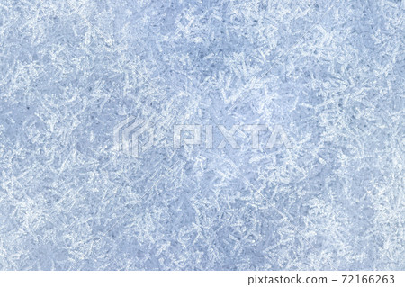 Top view of snow crystals illuminated by sunlight. Winter background. Top view of snow crystals illuminated by sunlight. Winter background. 72166263