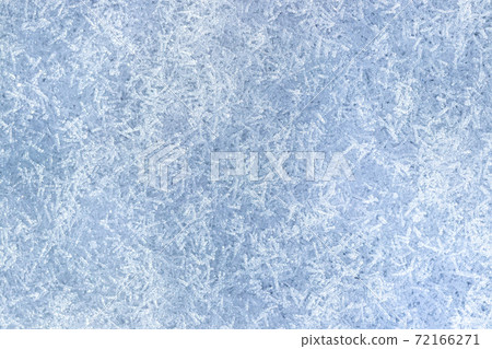 Top view of snow crystals illuminated by sunlight. Winter background. 72166271
