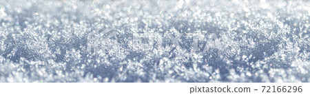 Snow crystals illuminated by sunlight. Winter background. Snow crystals illuminated by sunlight. Winter background. 72166296