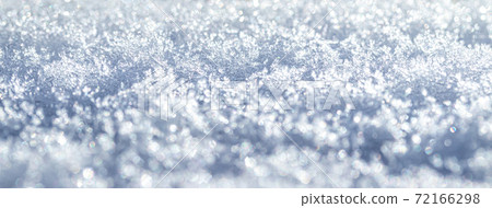 Snow crystals illuminated by sunlight. Winter background. Snow crystals illuminated by sunlight. Winter background. 72166298