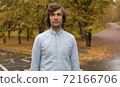 Portrait of a man in the park 72166706