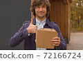 Man holding a disposable lunch box 72166724