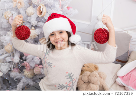 Go glam this xmas season. Happy child hold xmas tree balls. Little girl celebrate xmas and new year. Go glam this xmas season. Happy child hold xmas tree balls. Little girl celebrate xmas and new year. 72167359