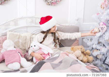 What a lovely ball. Little child play with toys at Christmas What a lovely ball. Little child play with toys at Christmas 72167360