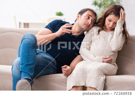 Man and pregnant woman in antismoking concept 72168938