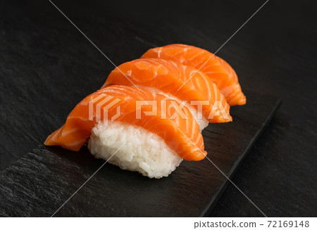 Slices of Raw Salmon Fillet on Black Background Mockup Top View Slices of Raw Salmon Fillet on Black Background Mockup Top View 72169148
