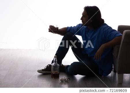 Young man suffering from alcoholism Young man suffering from alcoholism 72169609