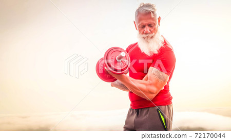 Senior man doing sport exercises 72170044