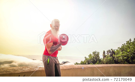 Senior man doing sport exercises 72170049