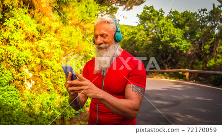 Senior man doing sport exercises 72170059