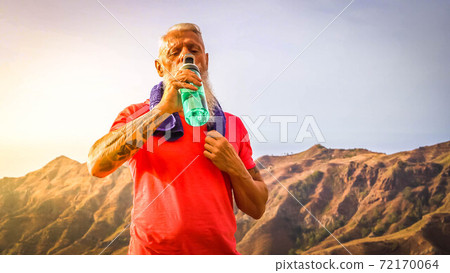 Senior man doing sport exercises Senior man doing sport exercises 72170064