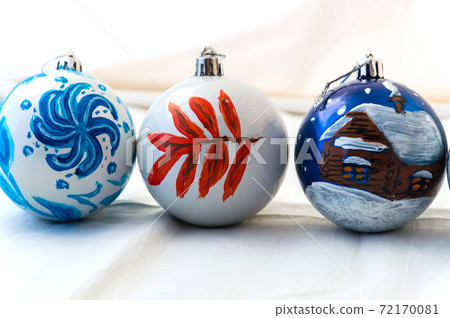 Christmas balls handmade. Three balls on light background. Decoration for the New year. Interior Christmas balls handmade. Three balls on light background. Decoration for the New year. Interior 72170081