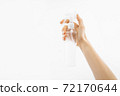 Bottle with antibacterial antiseptic gel in hand on white background 72170644