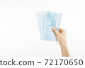 Close up of hand with mask, Surgical mask, on isolated white background, coronavirus disease 72170650