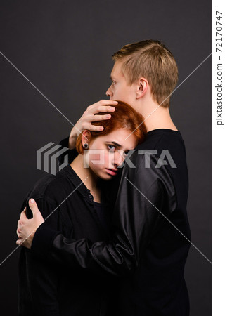 Desparate young woman with aggressive man in studio, domestic violence conception 72170747