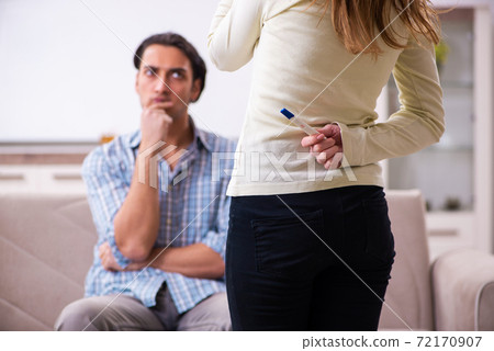 Young couple in unexpected pregnancy concept at home 72170907