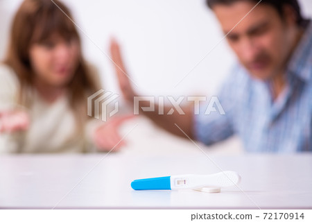 Young couple in unexpected pregnancy concept at home 72170914