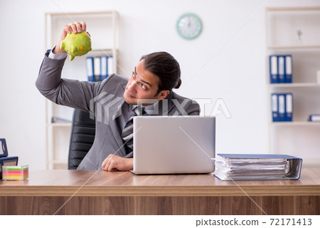 Young male employee in pension concept at workplace 72171413