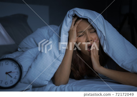 Depressed young woman lying in bed cannot sleep from insomnia 72172049
