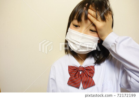 Unwell girl with mask coughing sneezing fever Unwell girl with mask coughing sneezing fever 72172199