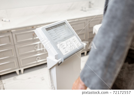 Man measuring body composition balance, close-up 72172557