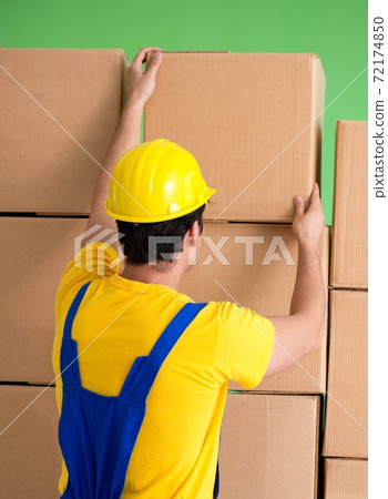 Man contractor working with boxes delivery Man contractor working with boxes delivery 72174850