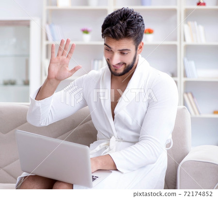 The young man freelancer working from home on a laptop The young man freelancer working from home on a laptop 72174852