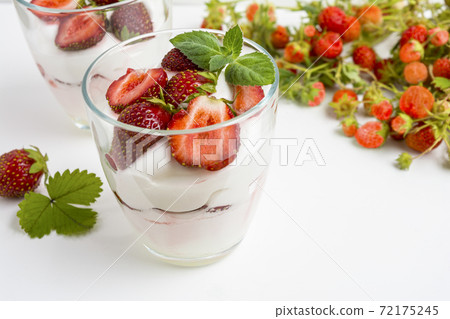 Fresh layered strawberry dessert with yogurt Fresh layered strawberry dessert with yogurt 72175245