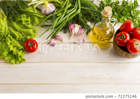 Fresh vegetables and olive oil background Fresh vegetables and olive oil background 72175246