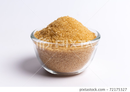 brown sugar In glass cup isolated on white background brown sugar In glass cup isolated on white background 72175327