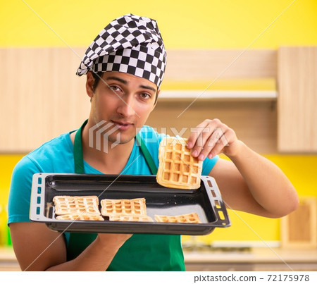 Man cook preparing cake in kitchen at home 72175978