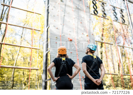 Sports couple near the climbing wall Sports couple near the climbing wall 72177226