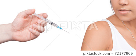 Doctor gives a syringe with vaccine to patient at clinic. Doctor gives a syringe with vaccine to patient at clinic. 72177909