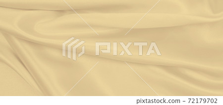 Smooth elegant golden silk or satin luxury cloth texture as wedding background. Luxurious background design. In Sepia toned. Retro style 72179702