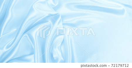 Smooth elegant blue silk or satin luxury cloth texture as abstract background. Luxurious background design Smooth elegant blue silk or satin luxury cloth texture as abstract background. Luxurious background design 72179712