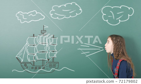 Pre-adolescent girl blowing on painted sailing ship Pre-adolescent girl blowing on painted sailing ship 72179802