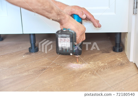 Construction and repair, doorstop, installation of door stop tools on floor with tool 72180540