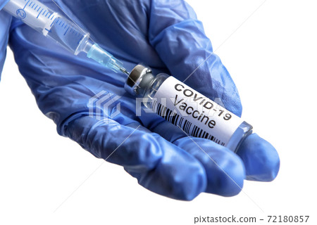 COVID-19 vaccine bottle and syringe in doctor`s hand for coronavirus cure isolated on white 72180857