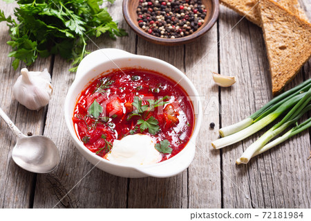 Homemade bowl with borscht and herbs Homemade bowl with borscht and herbs 72181984