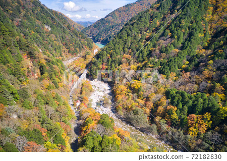 Magnificent view of Takase Valley and beautiful autumn leaves Omachi City, Nagano Prefecture (aerial view by drone) Magnificent view of Takase Valley and beautiful autumn leaves Omachi City, Nagano Prefecture (aerial view by drone) 72182830
