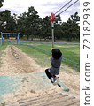Girl playing with play equipment 72182939